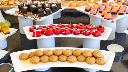 Assortment of oriental sweets in a restaurant. Dishes with pastries and cakes for lunch at a Turkish hotel.