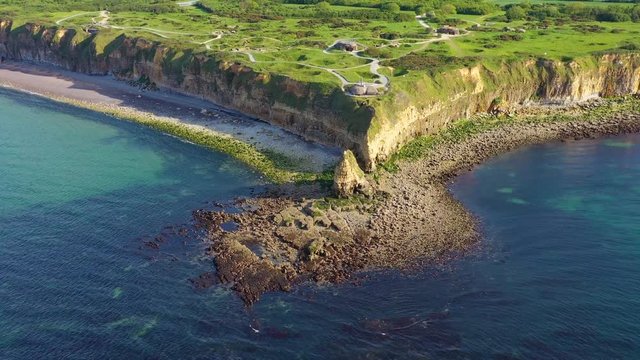 Aerial over Pointe Du Hoc, Normady, France D-Day site pockmarked with bomb craters.