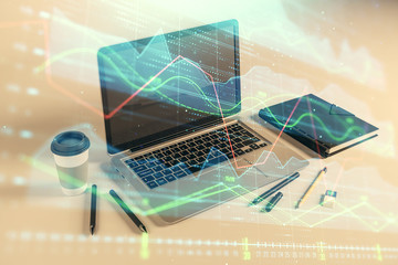 Forex graph hologram with desktop office computer background. Double exposure. Concept of financial analysis.