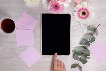 Women touching a tablet 