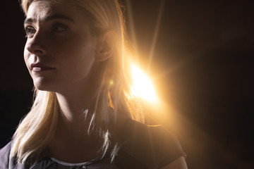 Businesswoman standing on stage in auditorium 