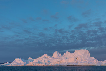 Huge icebergs of different forms in the Disko Bay, West Greenland. Their source is by the...