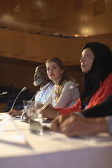 Business colleague sitting together in the auditorium 