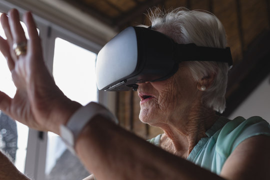 Senior woman using virtual reality headset