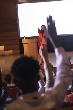 Audience raising hand for the queries in the auditorium