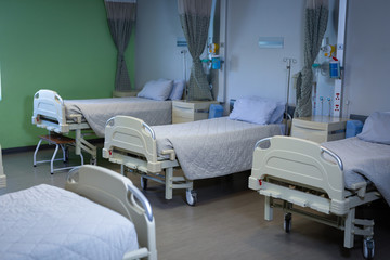 Row of empty hospital beds 