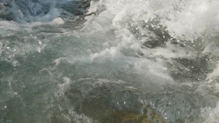 Slow motion sea waves crashing. Close-up shot.
