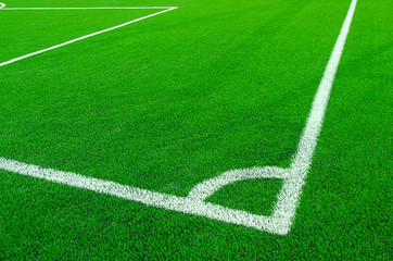 Obraz premium Artificial green grass with white stripe on sports fields for soccer and football.