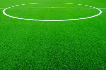 Obraz premium Artificial green grass with white stripe on sports fields for soccer and football.