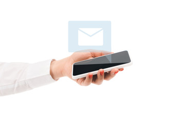 cropped view of woman holding smartphone with mail sign above isolated on white