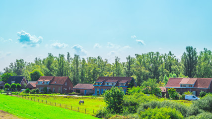 Dyke in front of Dutch houses