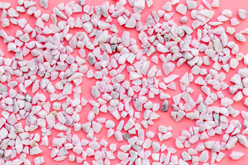little stones pattern on pink background top view
