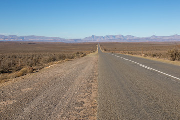 The N12 highway runs in places through the arid Klein Karoo region of South Africa image in landscape format with copy space