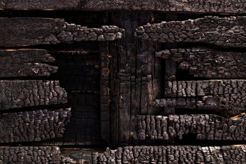 wall charred boards after fire