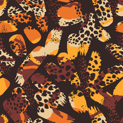 Tribal ethnic seamless pattern with animal print and brush strokes.