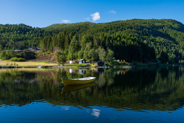 Fototapeta na wymiar Boat on lake Oppheimsvatnet. Voss, Norway. July 2019