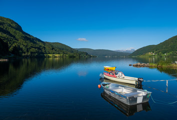 Fototapeta na wymiar Boat on lake Oppheimsvatnet. Voss, Norway. July 2019