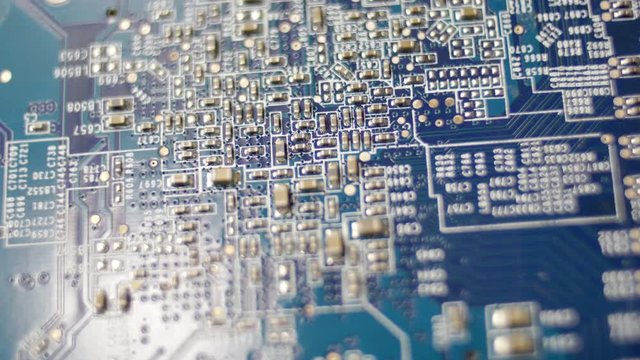 Computer Circuit Board with Electronic Chips Rotating Close Up