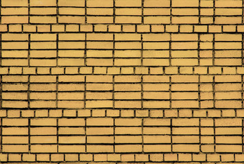 The texture of masonry bricks of regular shape yellowish color.