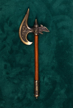 medieval poleax on a green background