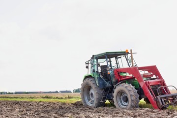 Full length view of tractor in farm