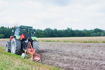 Full length view of tractor in field