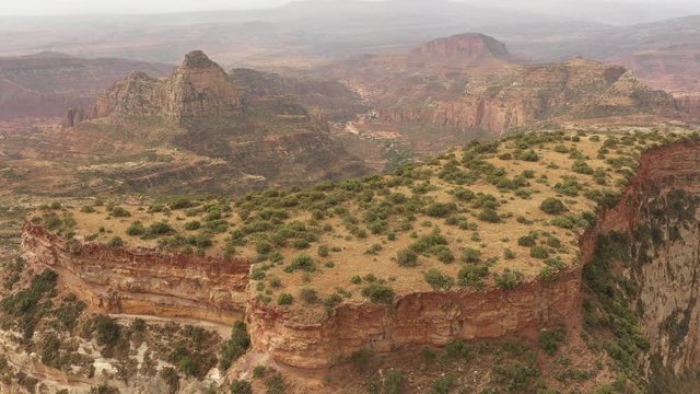 Ascending rotating drone shot of spectacular mountain plateau, erosion and wilderness in deserts of Tigray in Ethiopia Africa