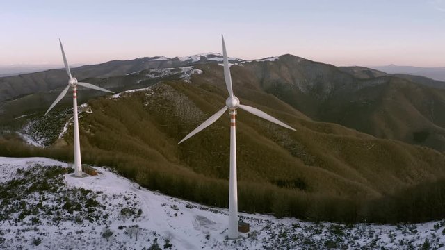 Wind turbines producing clean and sustainable energy aerial view