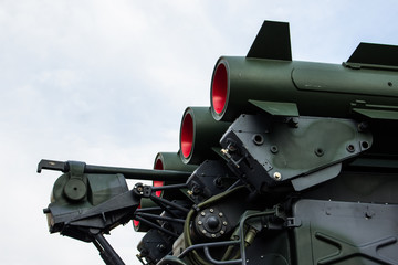 Fototapeta na wymiar Anti-aircraft missile system. Green army vehicle. Close up view