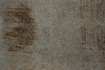 Cement surface sidewalk background. Rusty marks