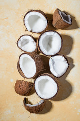 Ripe coconuts on color background
