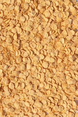Natural yellow solid background of corn flakes