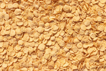 Natural yellow solid background of corn flakes