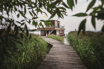 Boardwalk to a cozy house on the water