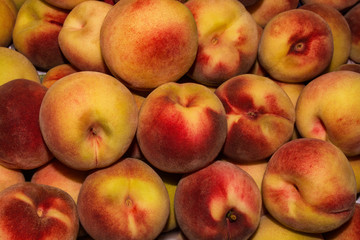 Peach Background. Texture background of sweet red ripe peaches. Ripe peaches close-up.