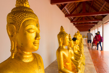 golden buddha at Wat Phra Borommathat Chaiya in Chaiya, Surat Thani, Thailand.