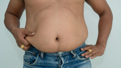 Naklejka premium Man fat overweigth show belly