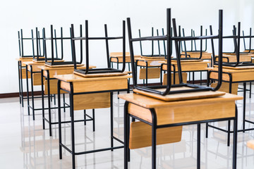 Lecture room or School empty classroom with desks and chair iron wood for studying lessons in high school thailand, interior of secondary education, with whiteboard, vintage tone educational concept