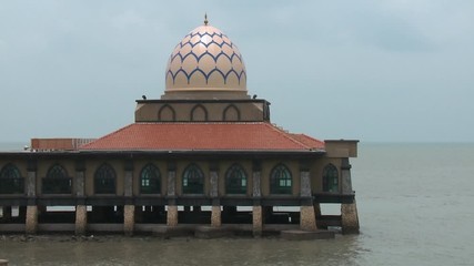 Medium low-angle still shot of beautiful Al Hussain mosque ( masjid) also know as Floating Mosque, Kuala Perlis, Malaysia