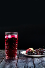 Barberry lemonade, ice drink. Enriched with vitamins. On a dark background