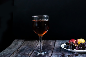 Amber wine. Wine in a glass. Traditional Georgian wine according to ancient technology. Close up