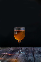 Amber wine. Wine in a glass. Traditional Georgian wine according to ancient technology. Close up