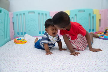Fototapeta premium Cute two little boy play in room