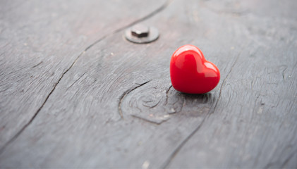 Fototapeta premium Red heart on wooden with soft light.