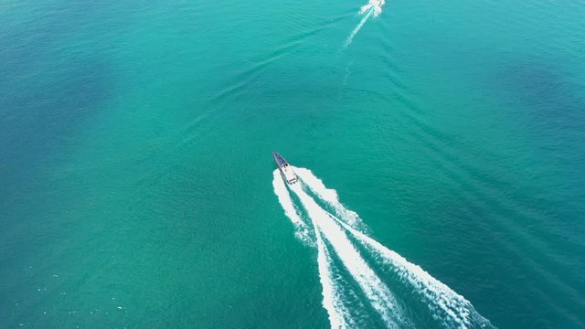 Aerial video with drone, the movement of boats on the water, Lake Garda, Italy.