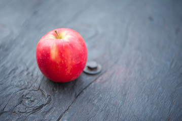 Close up of apple on wooden.