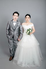 Asian couple taking wedding photography in studio
