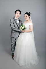 Asian couple taking wedding photography in studio