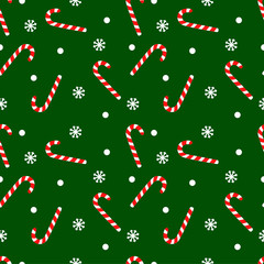 Vector seamless pattern with candy cane sweet sticks. Christmas or New Year festive background. Template for wrapping paper, gift, fabric or textile. Red candies and snowflakes on green background