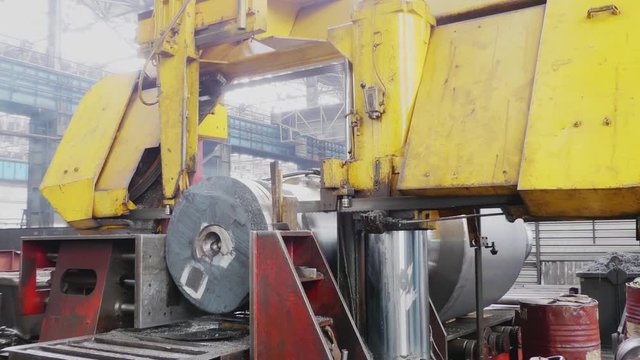 Rolling forming rolls metal works. Rolling mill machine for rolling steel sheet. Rolling mill machine with cooling water close up. Rolling mill preparation workshop. Machining of machine parts.